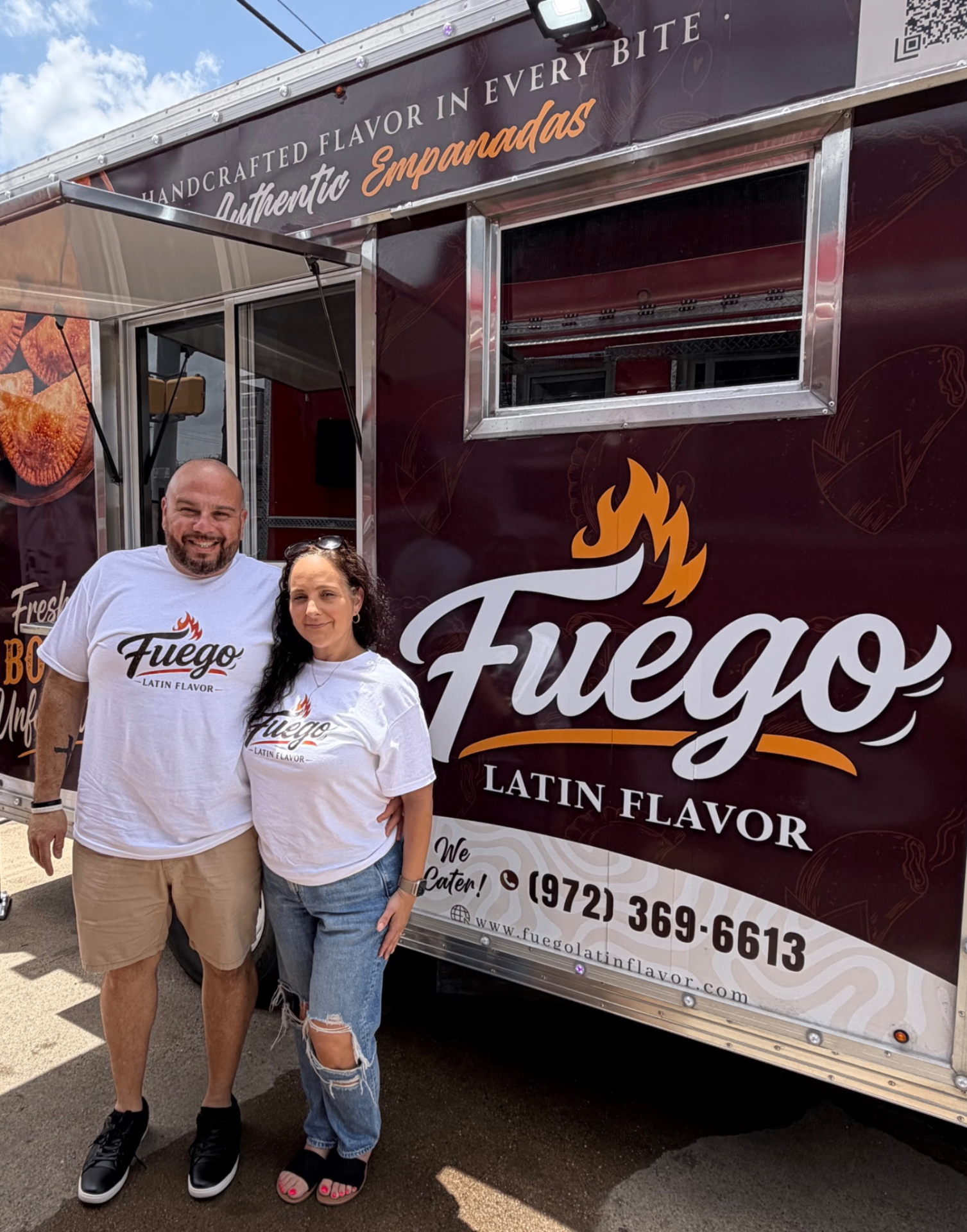Anthony and Sandra Mercado standing beside the Fuego Latin Flavor trailer